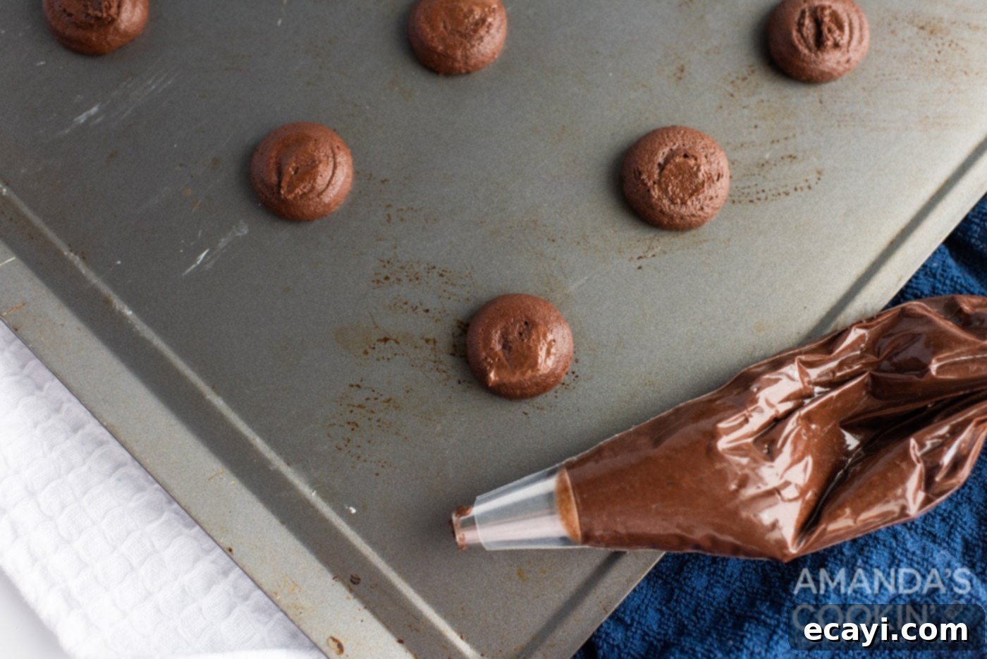 Velvety Chocolate Whoopie Indulgence 10 Piping chocolate whoopie pie dough onto a baking sheet in neat, even circles.