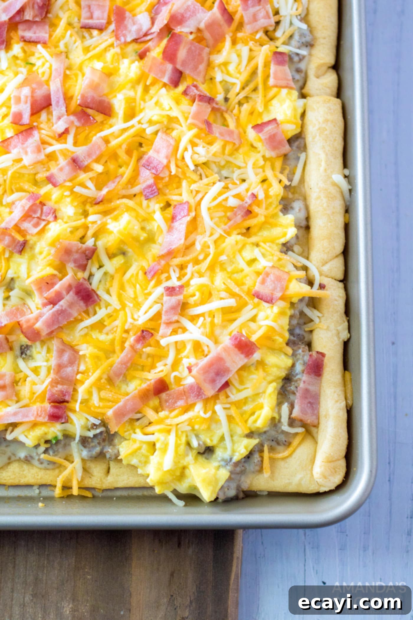 One-Pan Breakfast Pizza 7 shredded cheese, egg, and sausage on top of crescent dough
