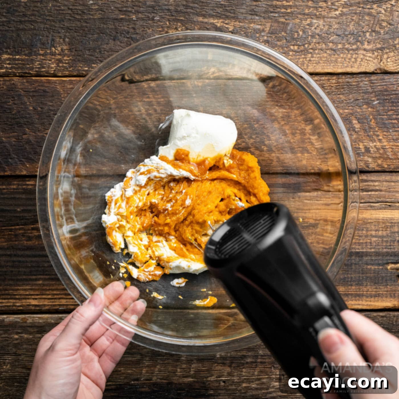 Spiced Pumpkin Pie Dip 5 hand mixer beating together pumpkin puree and cream cheese until smooth