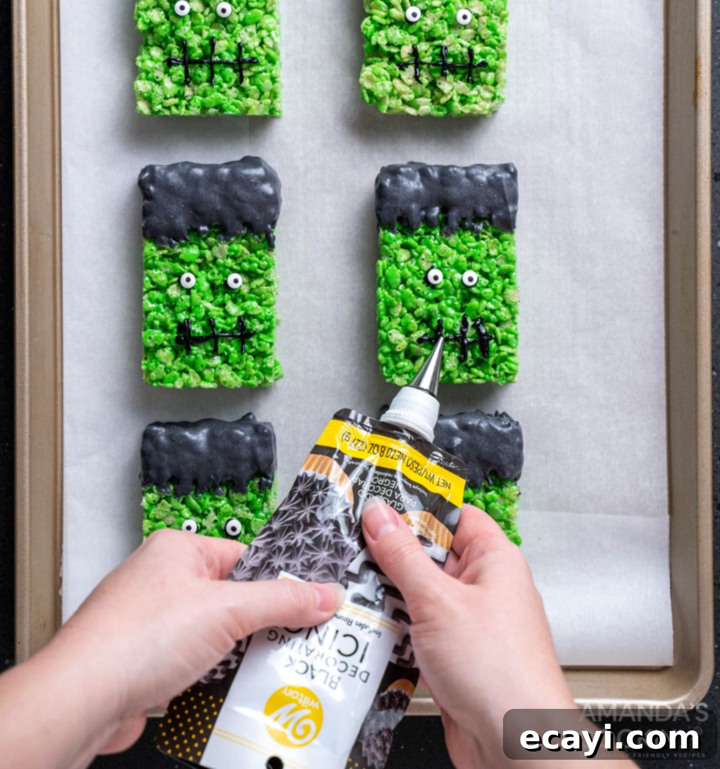 Franken-Crispy Treats 14 piping on frankenstein mouths to rice krispie treats
