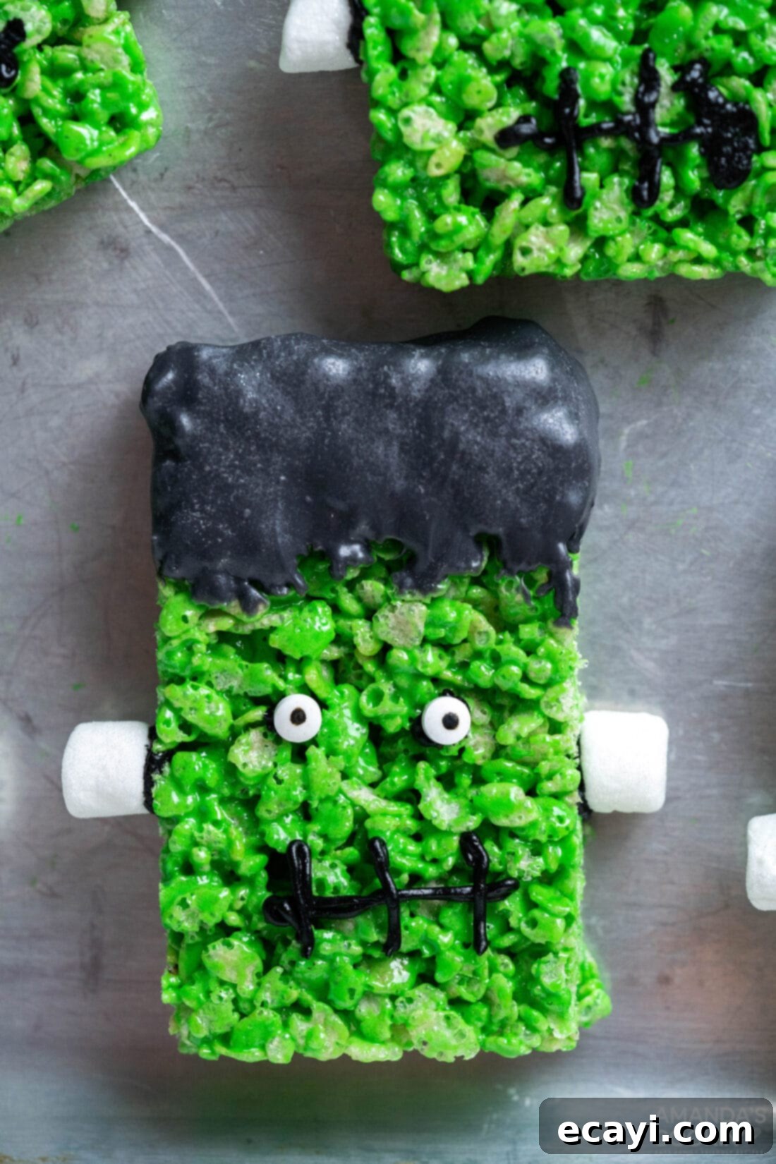 Franken-Crispy Treats 3 Frankenstein Rice Krispie Treats on a cookie sheet