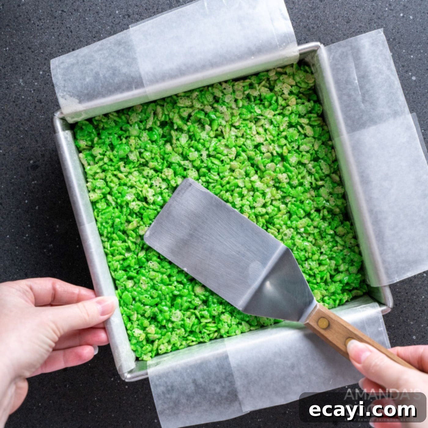 Franken-Crispy Treats 9 spatula patting flat rice krispie treats