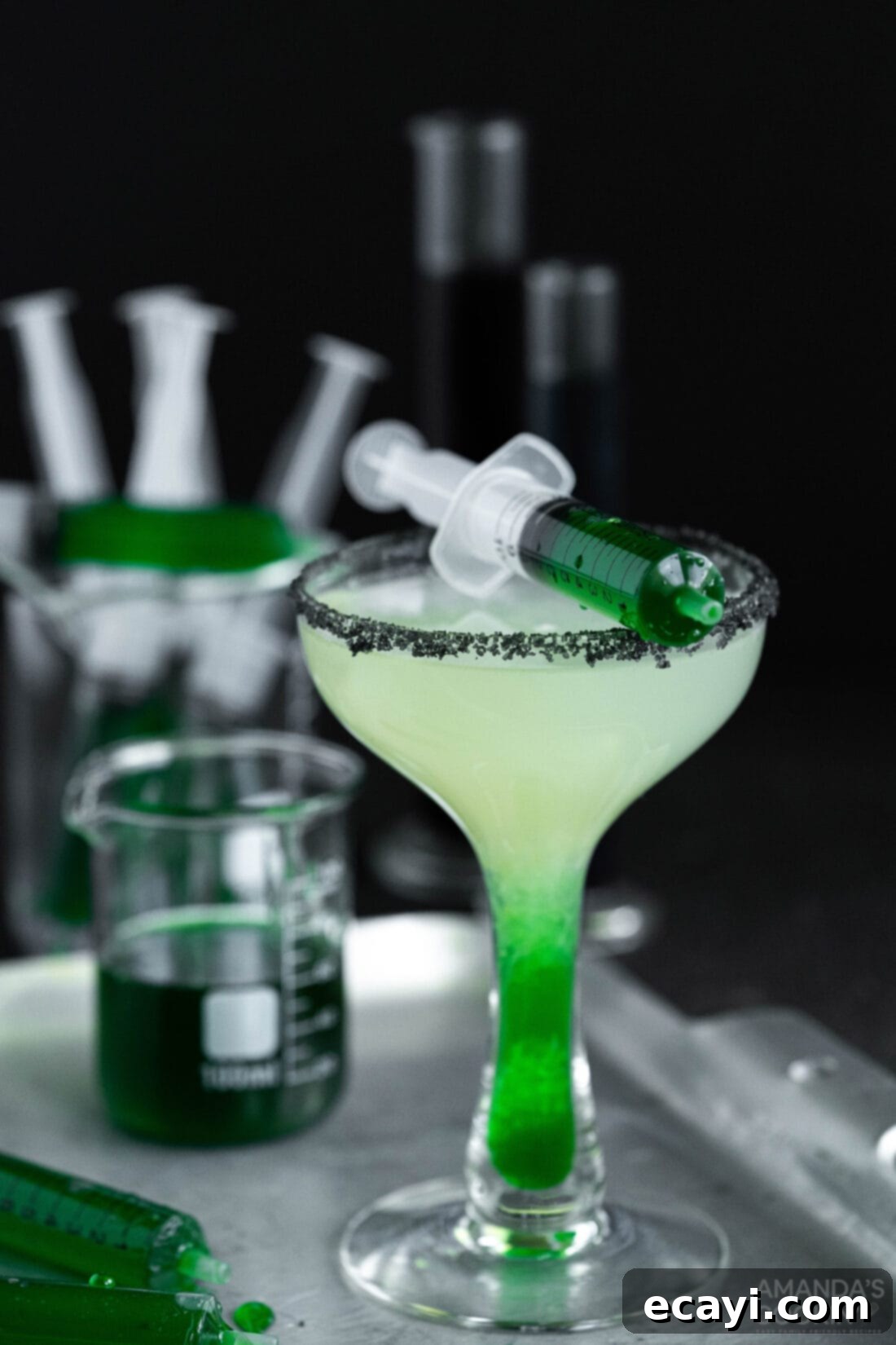 The Reanimated Margarita 47 Frankenstein Margarita on a platter, showcasing the vibrant green drink with black salt rim