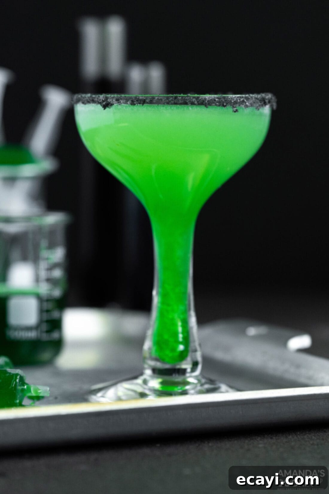 The Reanimated Margarita 3 Close-up of a vibrant green Frankenstein cocktail in a salt-rimmed glass