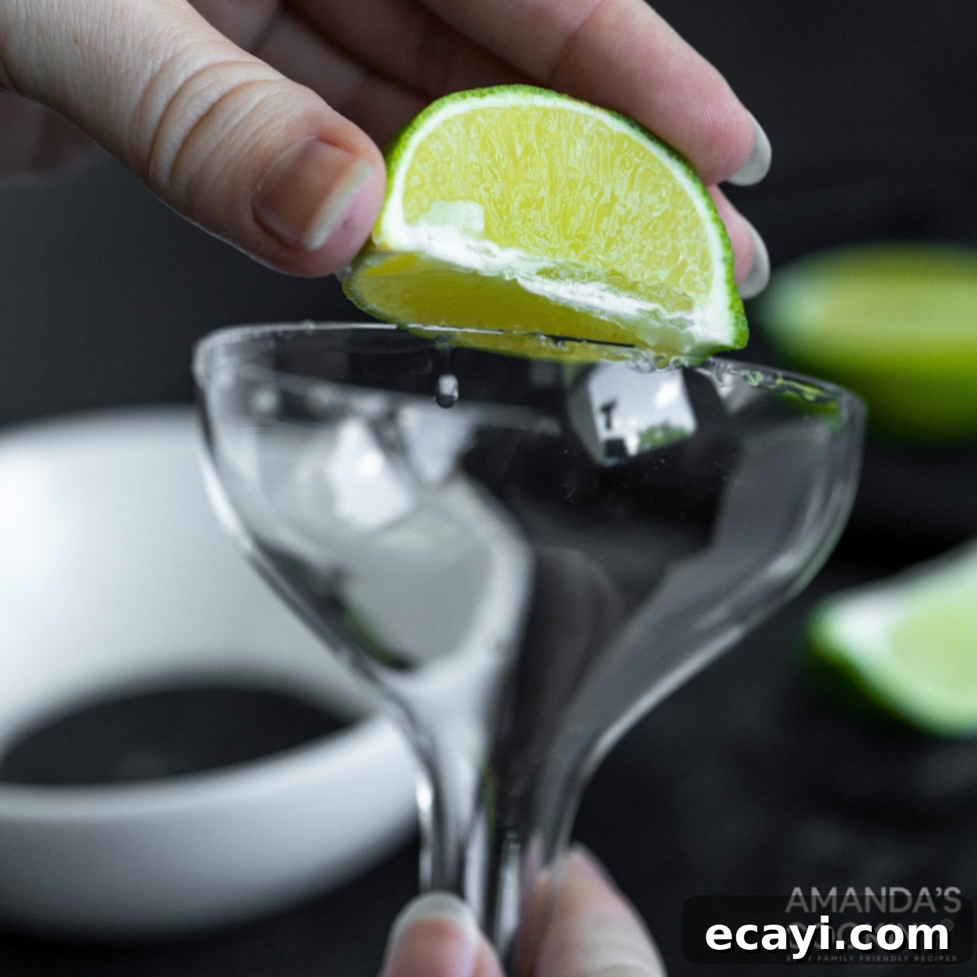 The Reanimated Margarita 5 rubbing lime wedge on margarita glass to prepare for salt rim