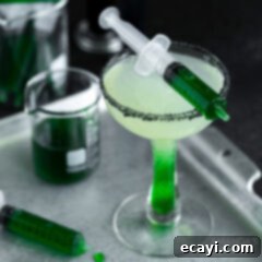 The Reanimated Margarita 9 Vibrant Frankenstein Margarita with a black salt rim
