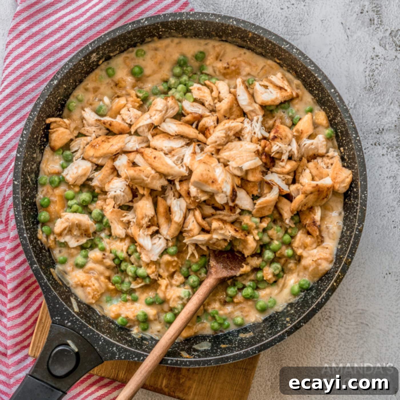 Golden Harvest Chicken Pot Pie 6 creamy pumpkin chicken pot pie filling with peas and butter in a skillet
