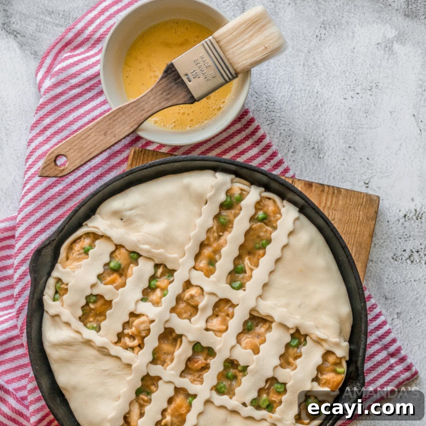 Golden Harvest Chicken Pot Pie 9 Close-up of a Pumpkin Chicken Pot Pie with a beautiful puff pastry lattice top before baking