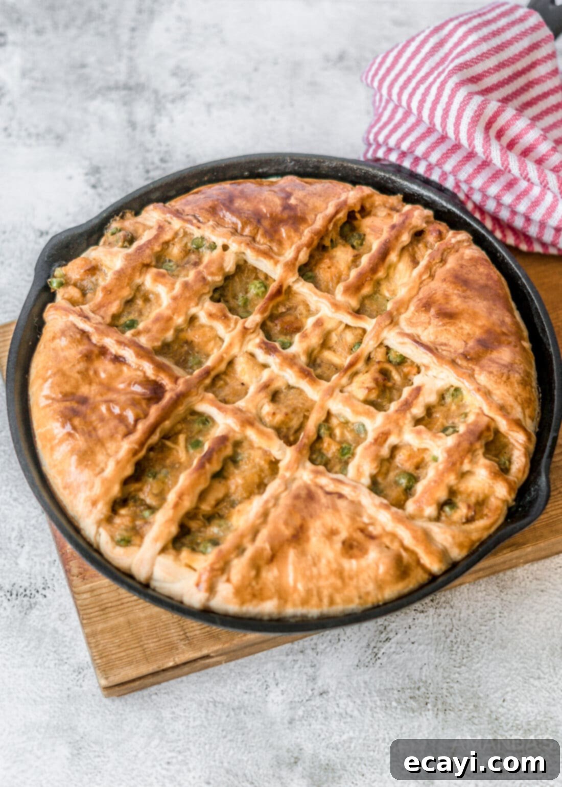 Golden Harvest Chicken Pot Pie 10 Golden brown pumpkin chicken pot pie fresh out of the oven in a cast iron pan