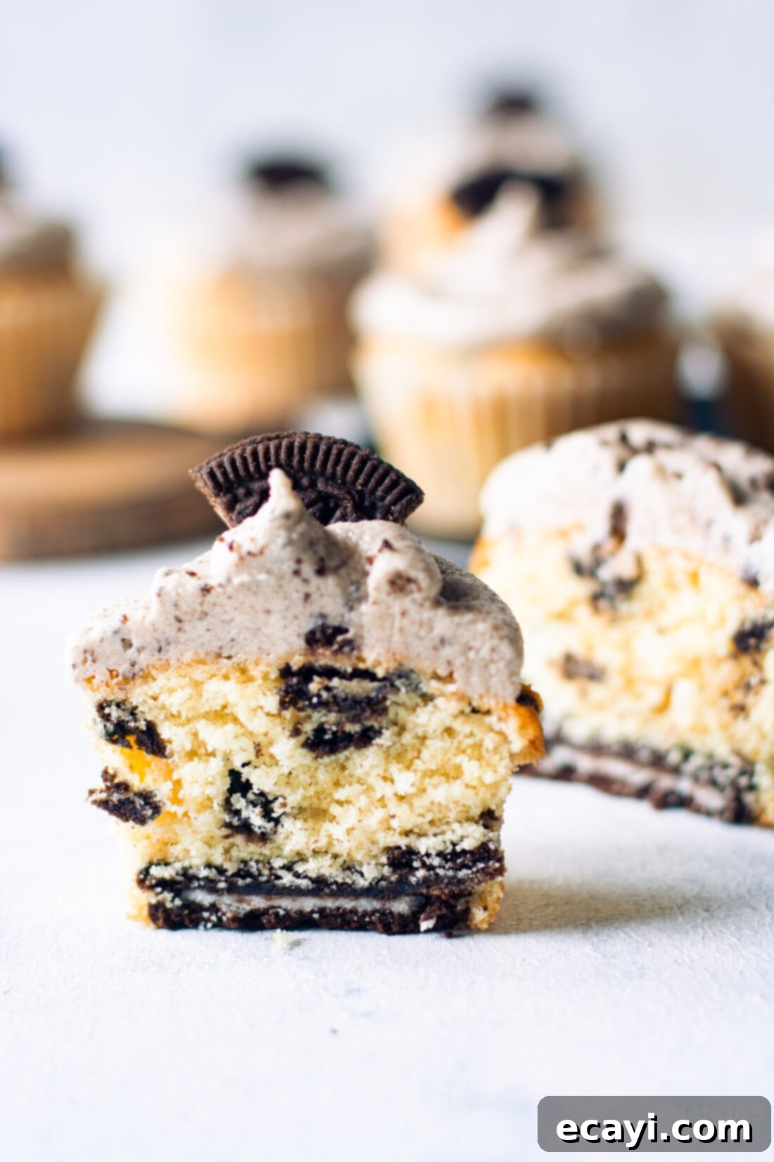 Ultimate Oreo Cupcakes 3 An Oreo Cupcake cut in half showing the whole Oreo cookie at the bottom