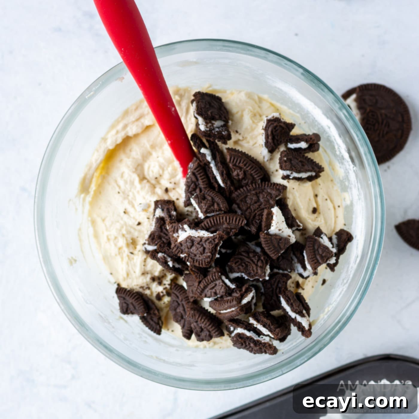 Ultimate Oreo Cupcakes 8 cupcake batter with crushed Oreos being mixed in a bowl