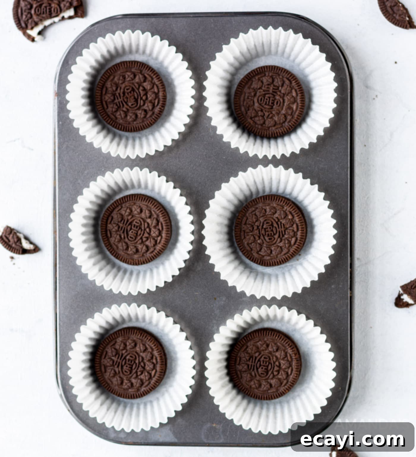 Ultimate Oreo Cupcakes 9 whole Oreo cookies placed at the bottom of cupcake liners