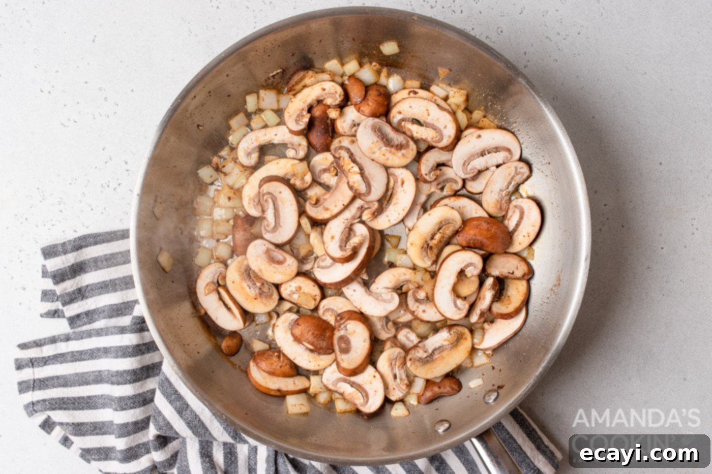 Creamy Chicken Stroganoff 7 mushrooms and onions in a skillet