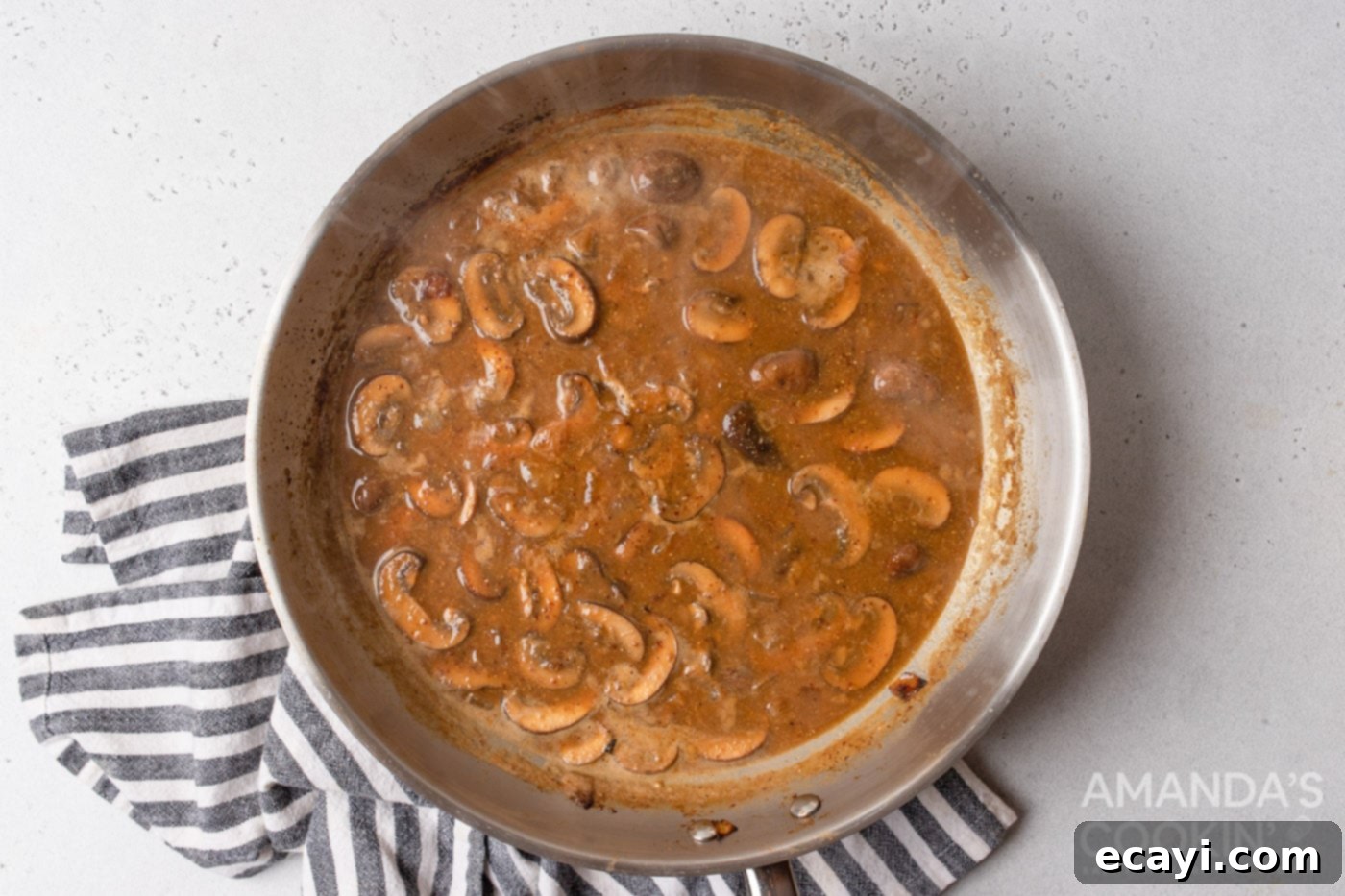 Creamy Chicken Stroganoff 9 chicken stock added to skillet of mushrooms and onions