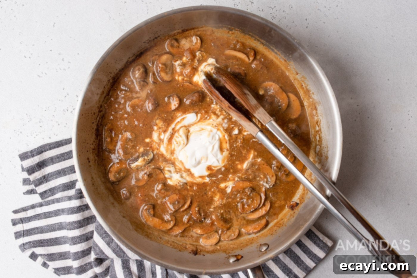 Creamy Chicken Stroganoff 10 stirring sour cream into stroganoff sauce