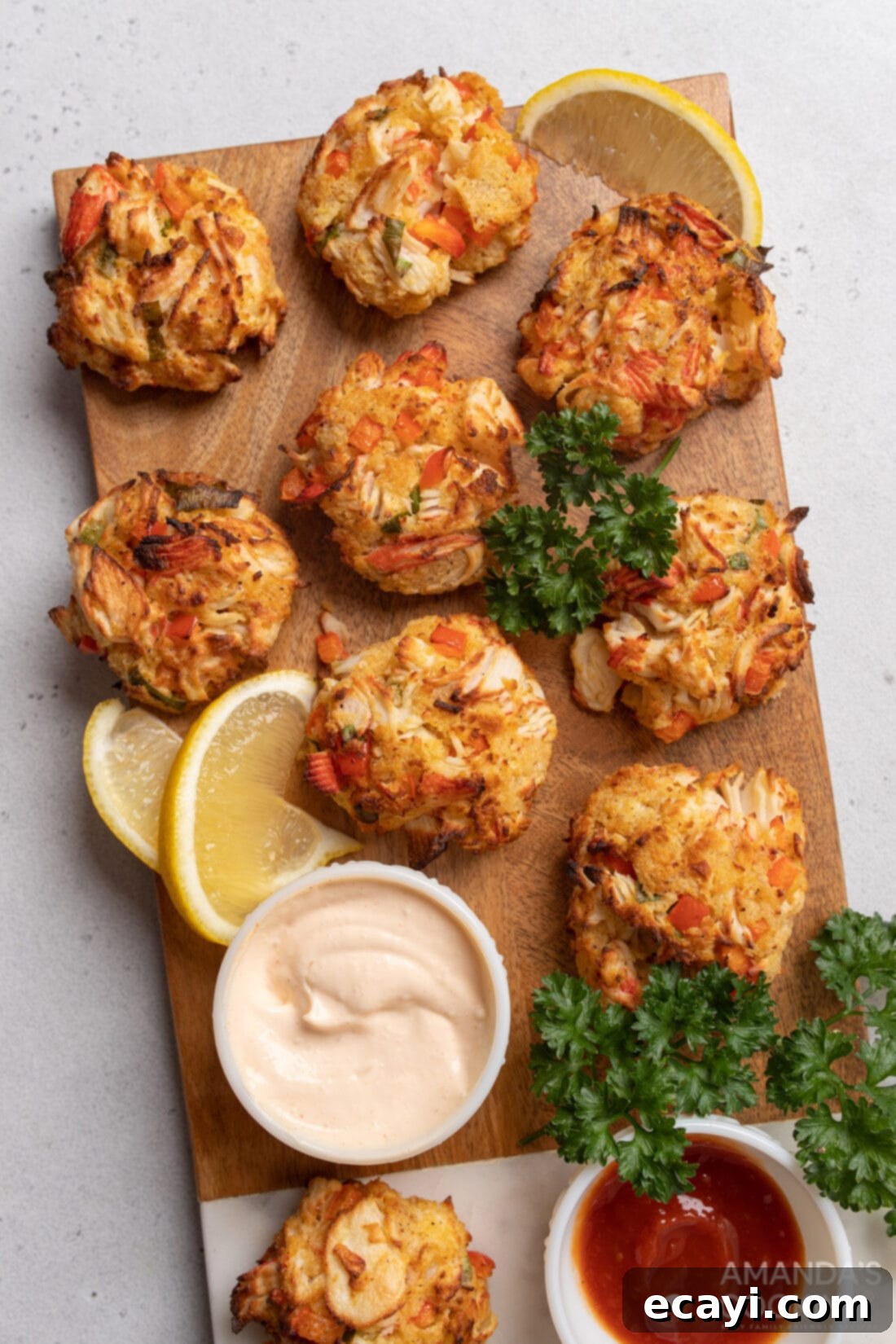 Crispy Air Fryer Crab Cakes 2 Air Fryer Crab Cakes ON A CUTTING BOARD