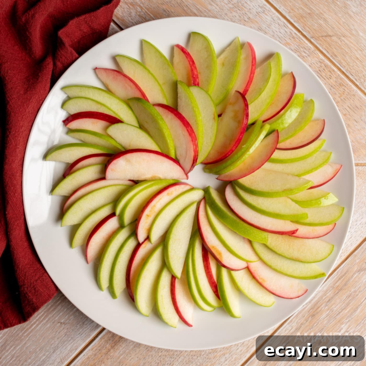 Orchard Nachos 5 sliced apples arranged on a plate, ready for toppings