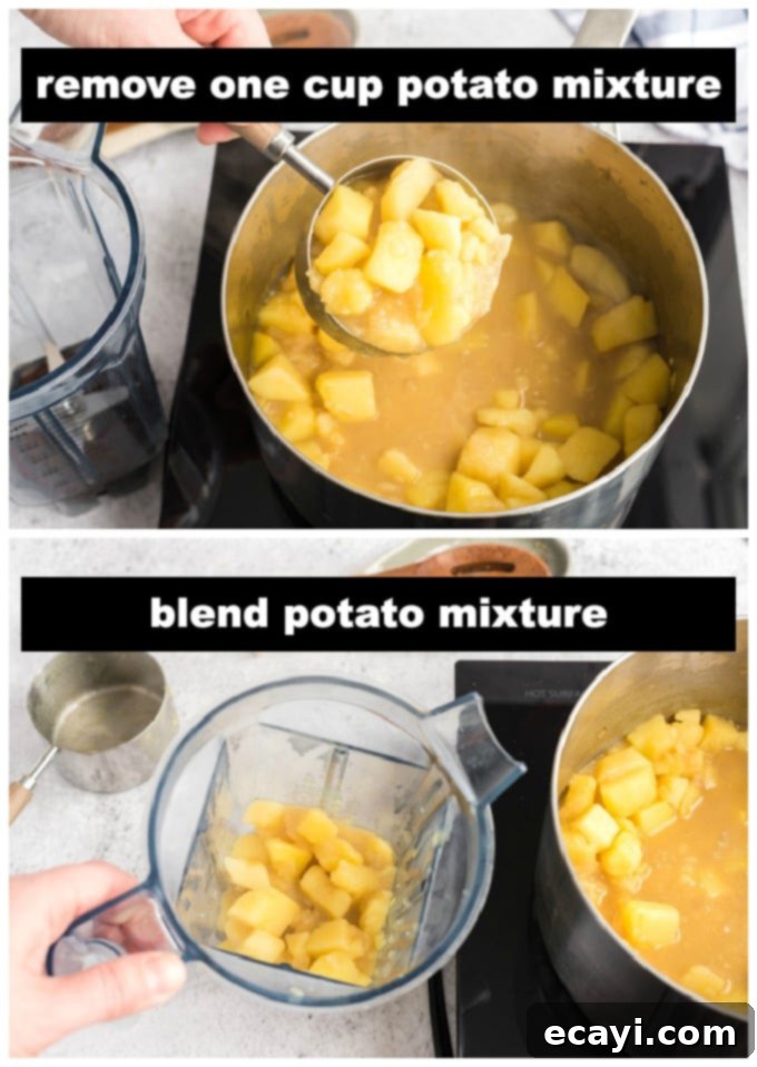 Creamy Cheddar Potato Soup 5 A ladle removing a cup of cooked potato and broth mixture from the saucepan for blending