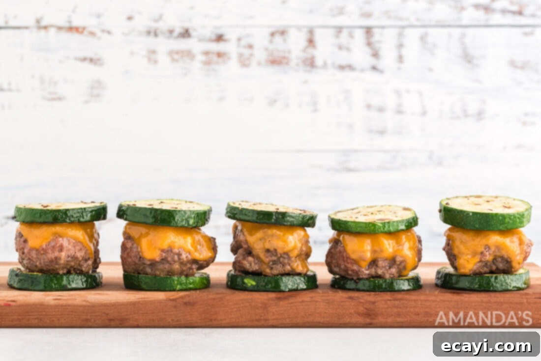 Mini Zucchini Bites 14 Zucchini Sliders arranged neatly on a wooden cutting board