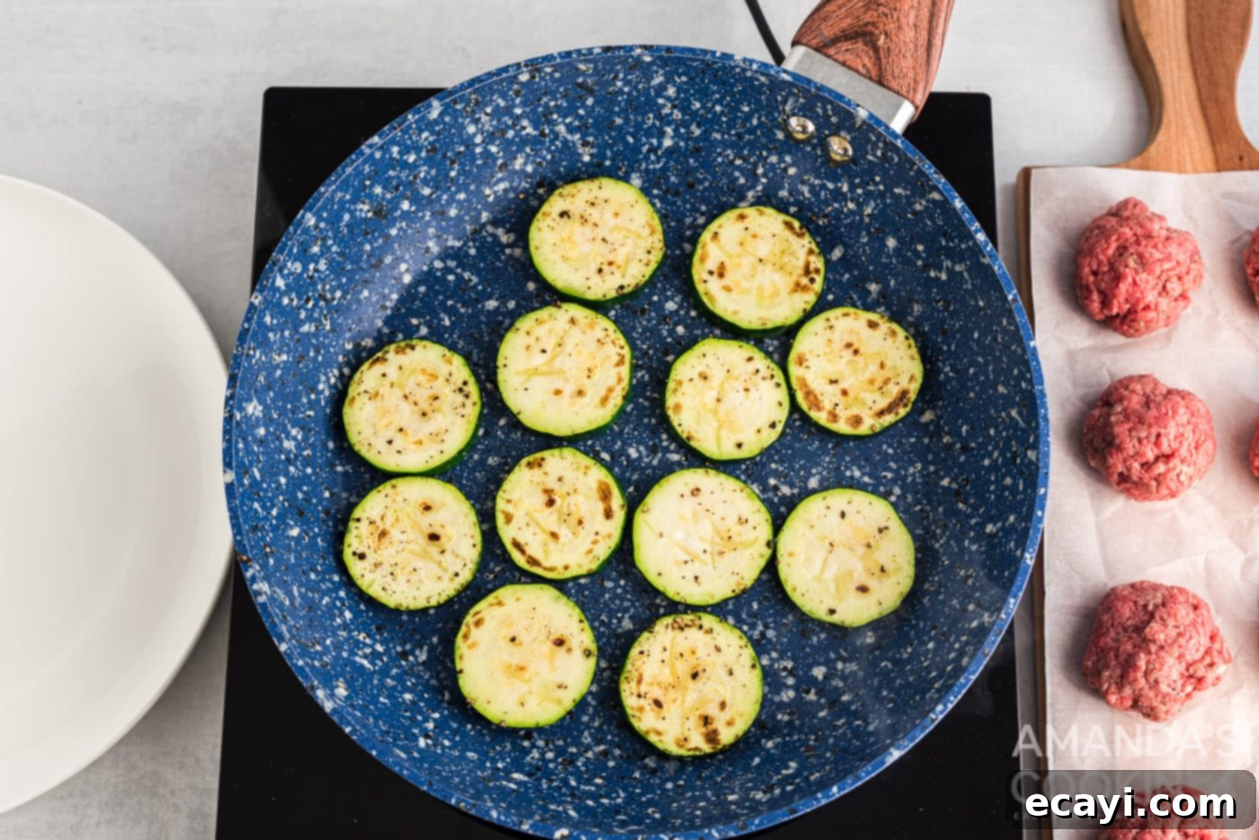 Mini Zucchini Bites 8 zucchini rounds browned to perfection in a skillet
