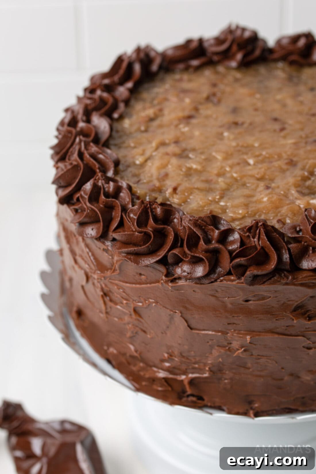 Decadent Coconut Pecan Chocolate Cake 2 Three-tiered Homemade German Chocolate Cake on a cake stand, ready to be served