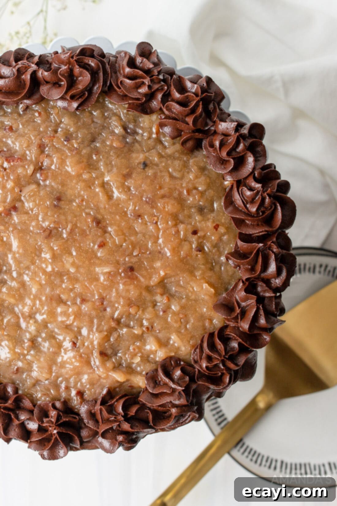 Decadent Coconut Pecan Chocolate Cake 9 Overhead view of a beautifully decorated German Chocolate Cake with a perfect slice removed