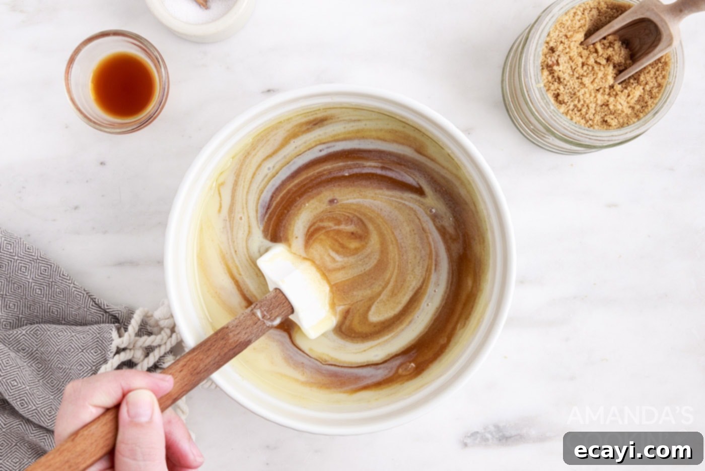 Microwave's Golden Delight 5 Sweetened condensed milk being whisked into a bowl of boiling caramel