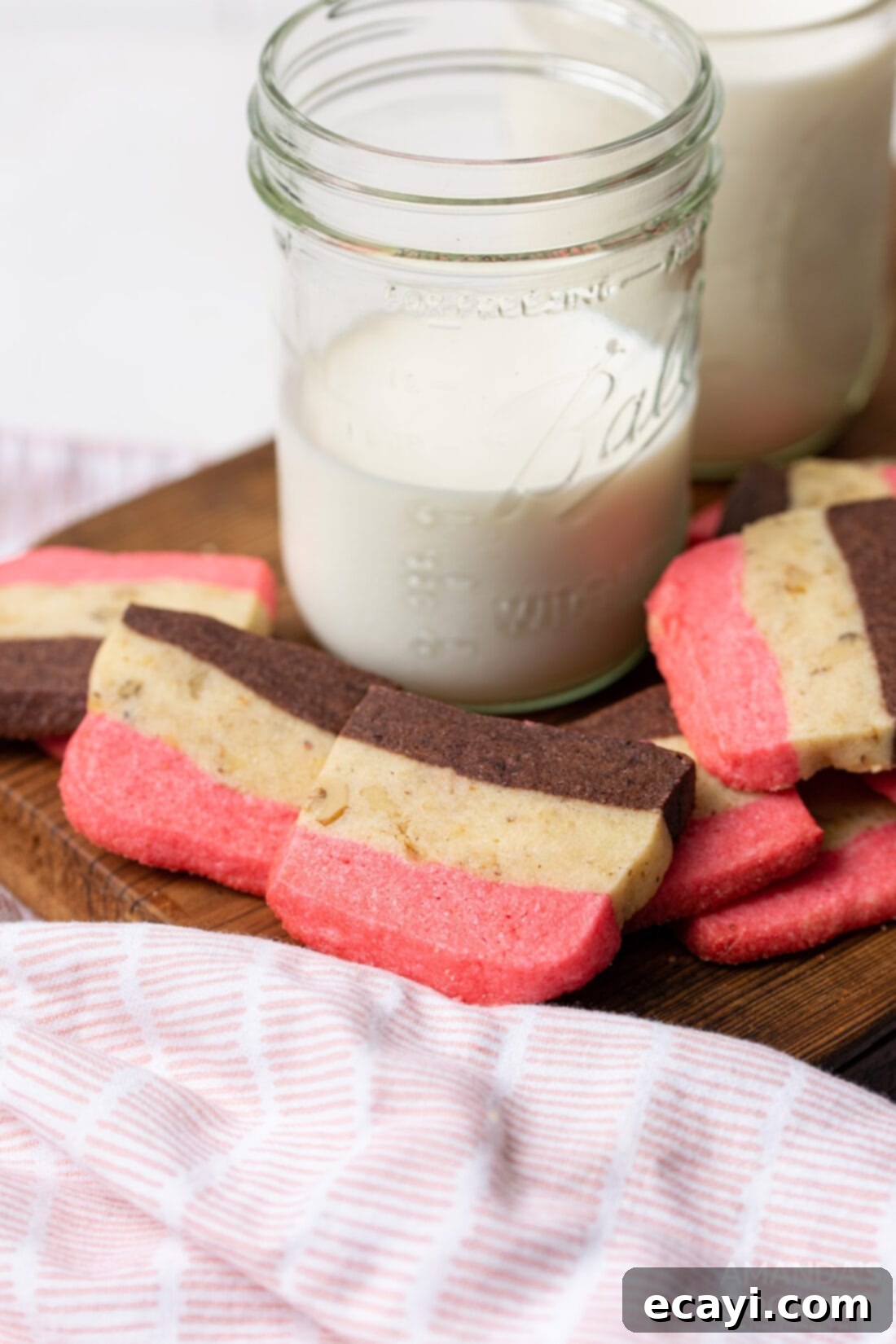 Colorful Neapolitan Delights 9 neapolitan cookies with glass of milk