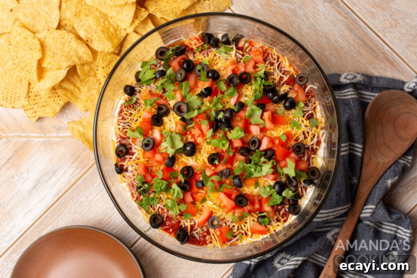 Ultimate Seven Layer Taco Dip 9 black olives in a bowl