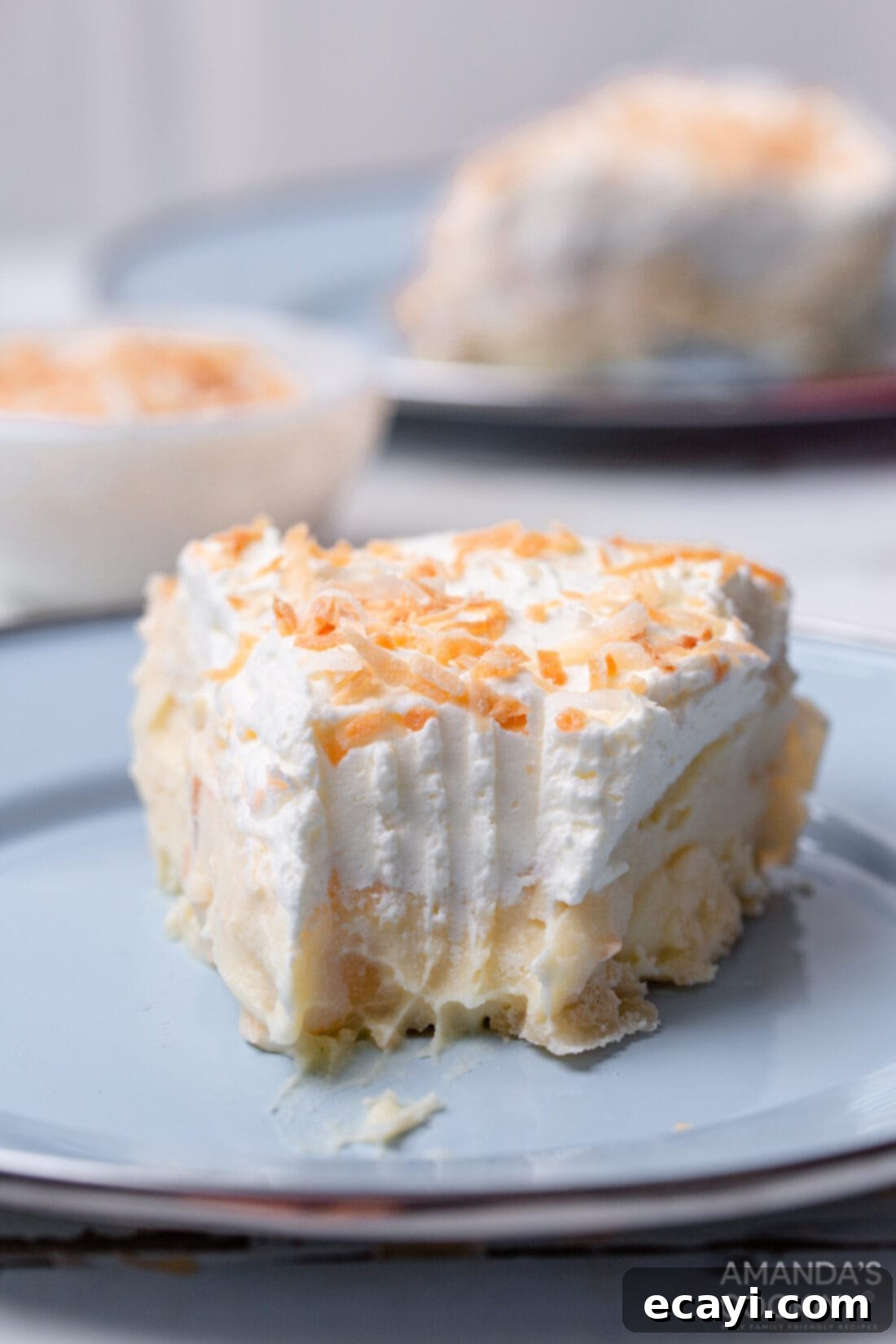 Velvet Coconut Cream Pie 3 Coconut Cream Pie with a bite out of it
