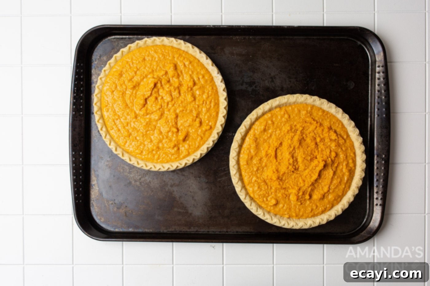 Classic Sweet Potato Pie 7 two sweet potato pies on a baking sheet, ready to cool