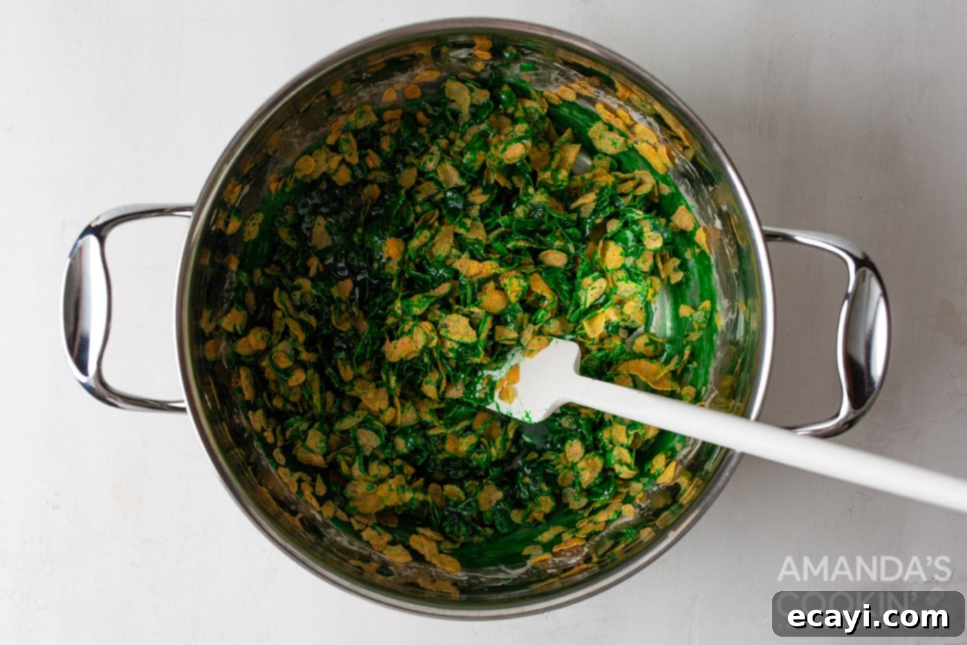 Homemade Cornflake Christmas Wreaths 5 green food color in mashmallow mixture