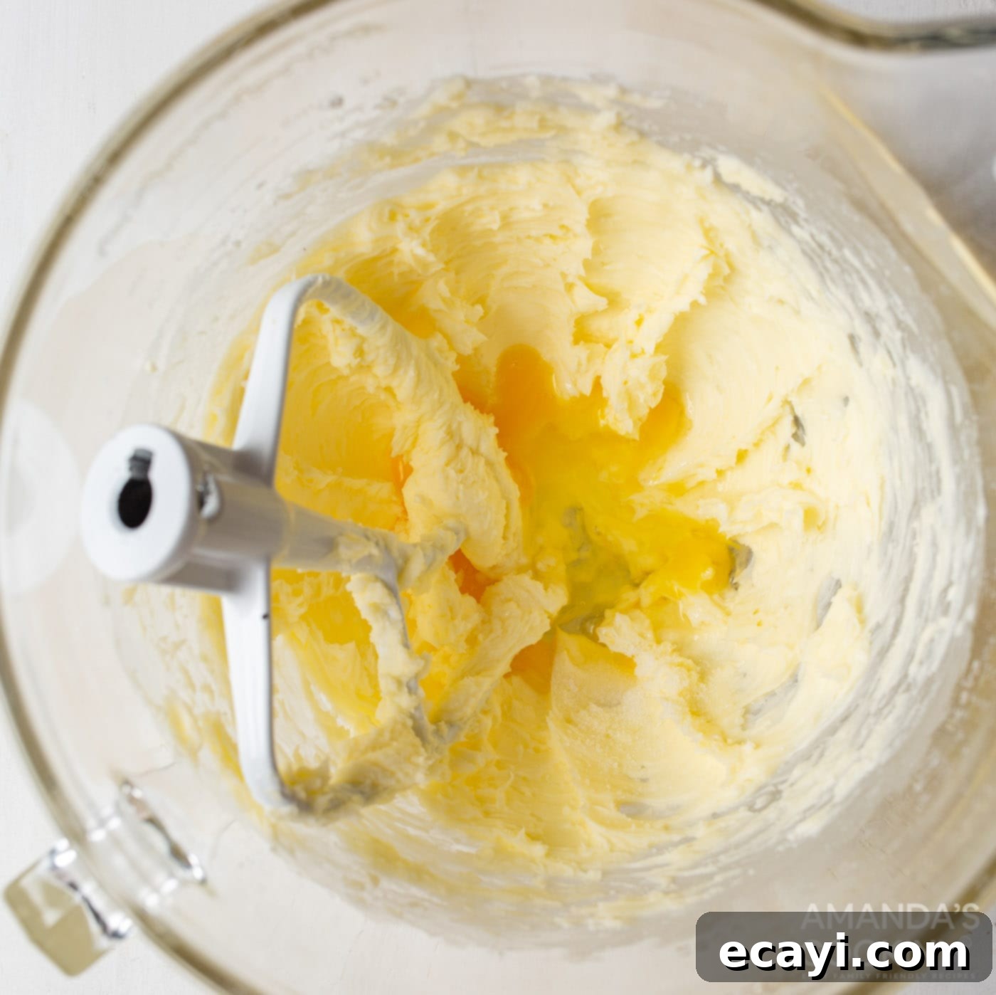 Buttery Danish Cookie Perfection 6 Creamed butter, sugar, egg, and vanilla mixture in a bowl with a paddle attachment