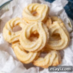 Buttery Danish Cookie Perfection 8 Danish Butter Cookies stacked elegantly on a plate