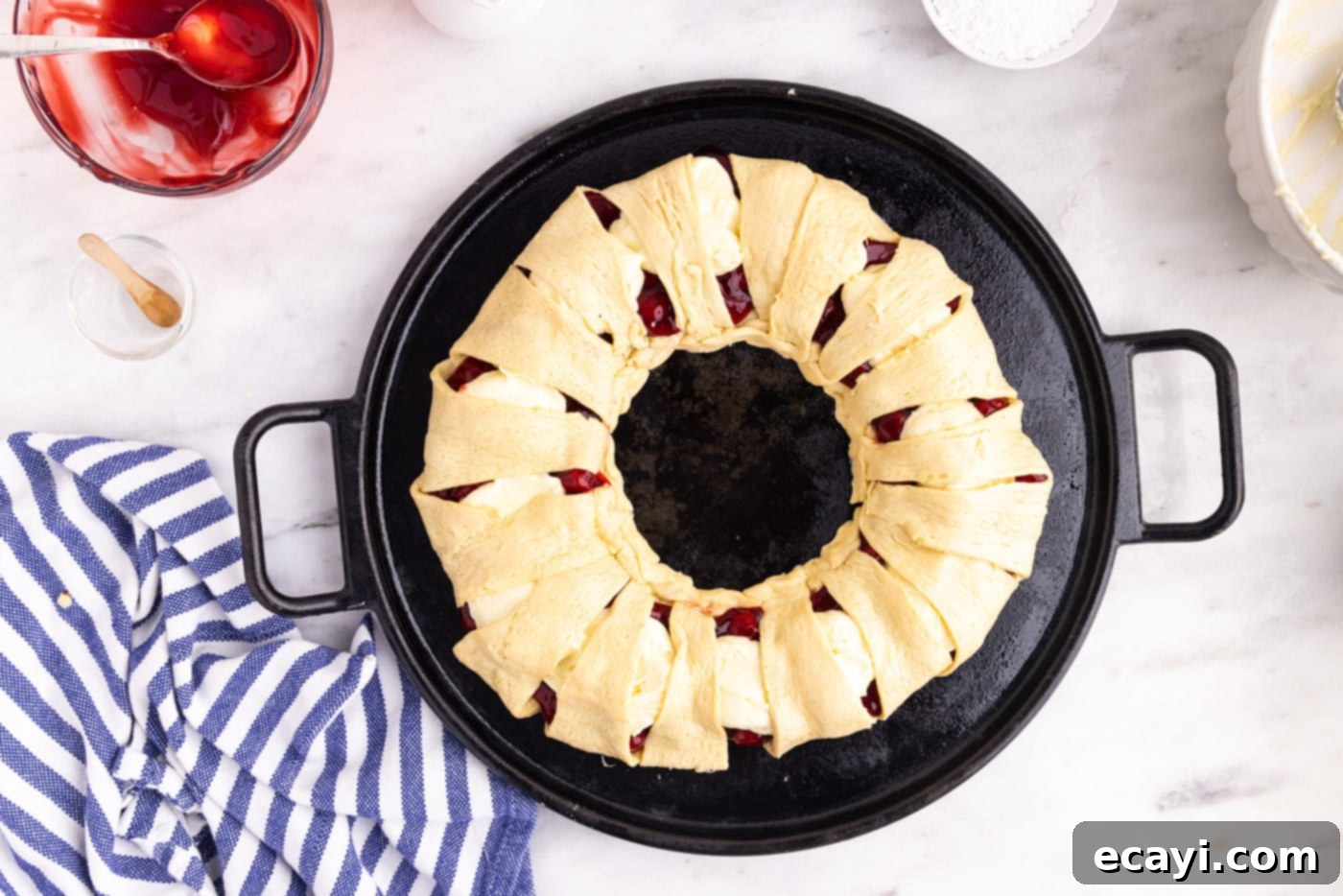 Artisan Danish Wreath 9 The assembled cherry and cream cheese crescent roll danish wreath, ready for baking.