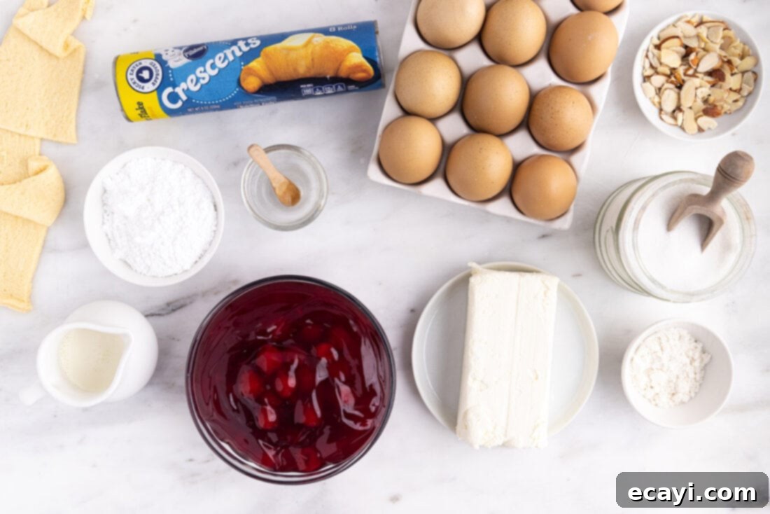 Artisan Danish Wreath 4 All the fresh ingredients laid out for making a Cherry Cream Cheese Crescent Danish Wreath: crescent rolls, cherry pie filling, cream cheese, sugar, egg, flour, and icing components.