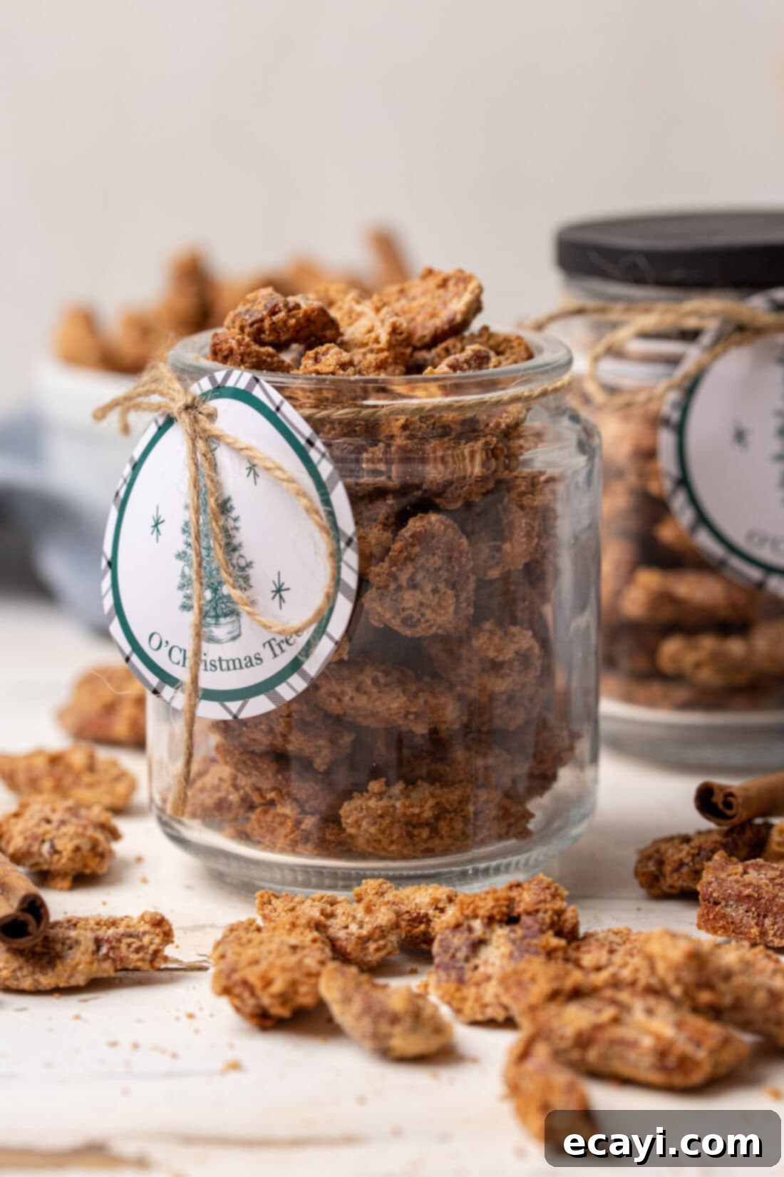 Sweet Pecan Delights 11 Close-up of candied pecans beautifully presented in a glass jar, perfect as a gourmet gift