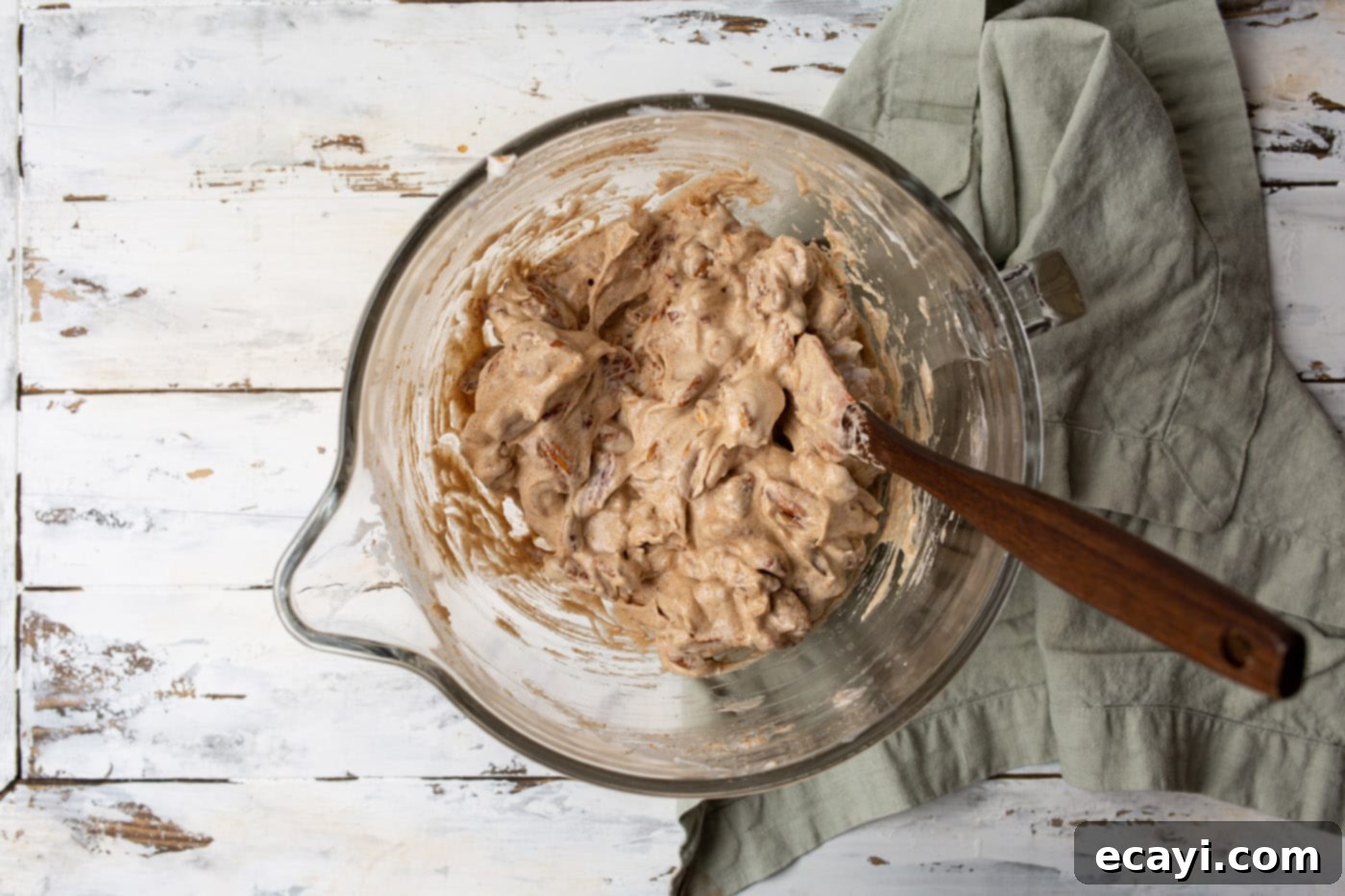 Sweet Pecan Delights 9 Pecan halves mixed with a generous cinnamon sugar coating in a large bowl