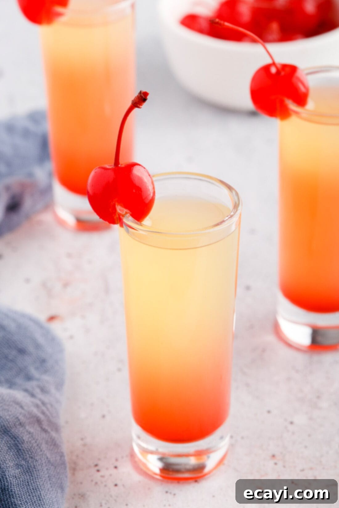 Pineapple Cake Flip Shot 2 Pineapple Upside Down Cake Shot garnished with a cherry