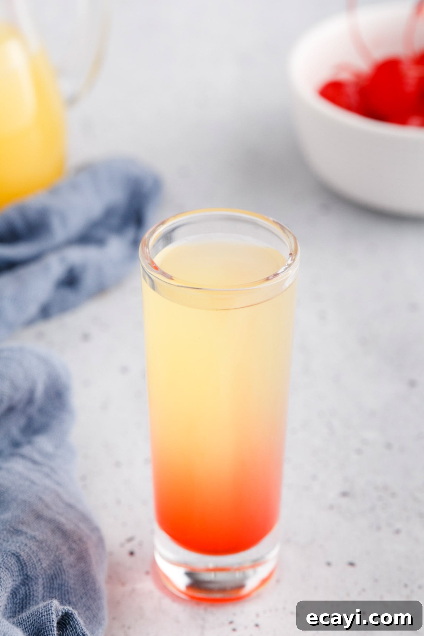Pineapple Cake Flip Shot 7 shot glass with grenadine, pineapple juice, and vodka