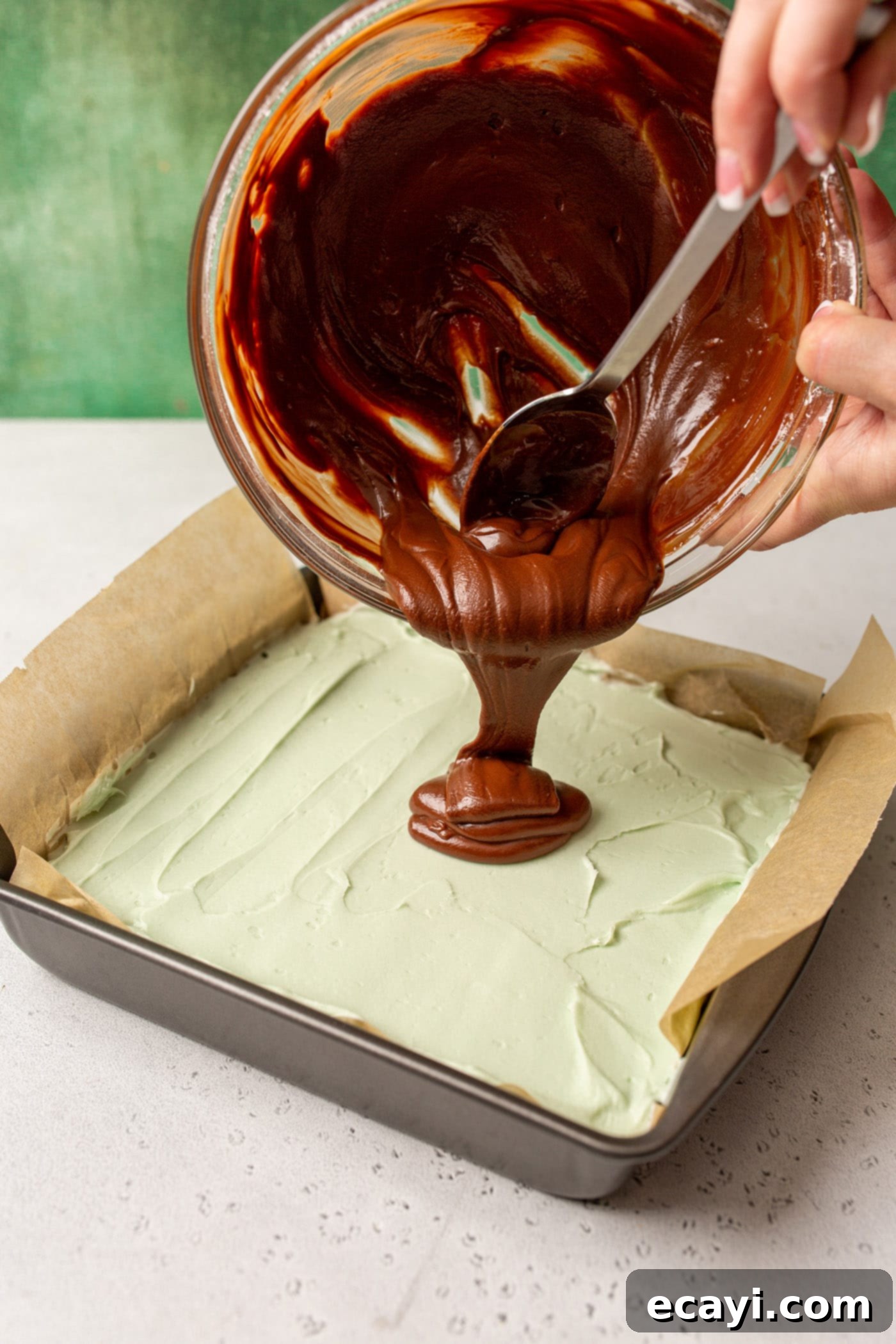 Decadent Mint Chocolate Brownies 12 pouring chocolate ganache onto mint chocolate brownies