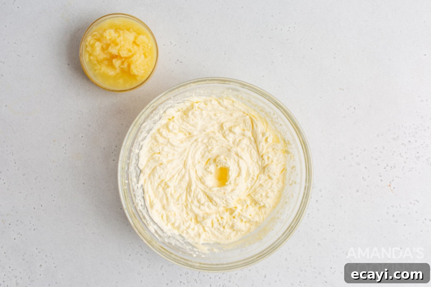 Sunshine Pineapple Orange Cake 8 Creamy pineapple frosting in a bowl, ready for topping the cake