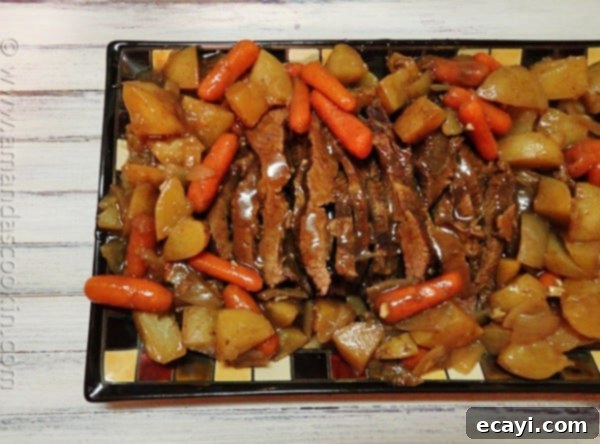 Slow Cooker Java Brisket An overhead photo of a plate of slow cooker java brisket.