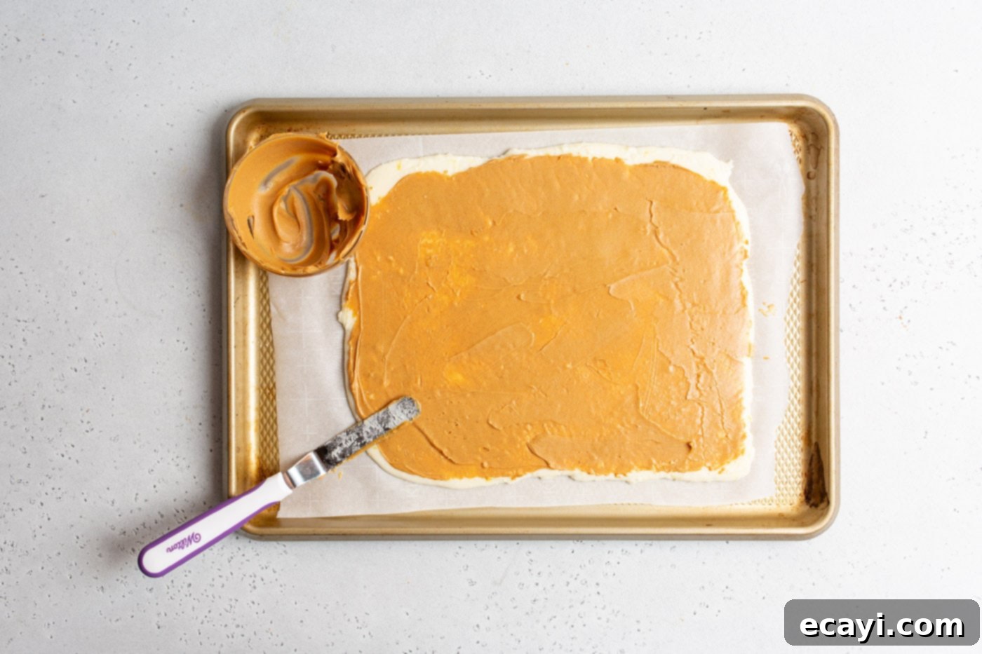 Peanut Butter Potato Delights 9 offset spatula smoothing peanut butter on potato dough