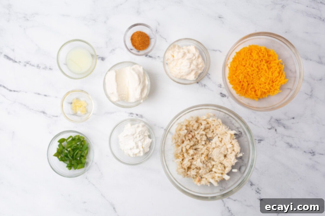 Decadent Crab Dip 4 ingredients for homemade Crab Dip laid out on a kitchen counter