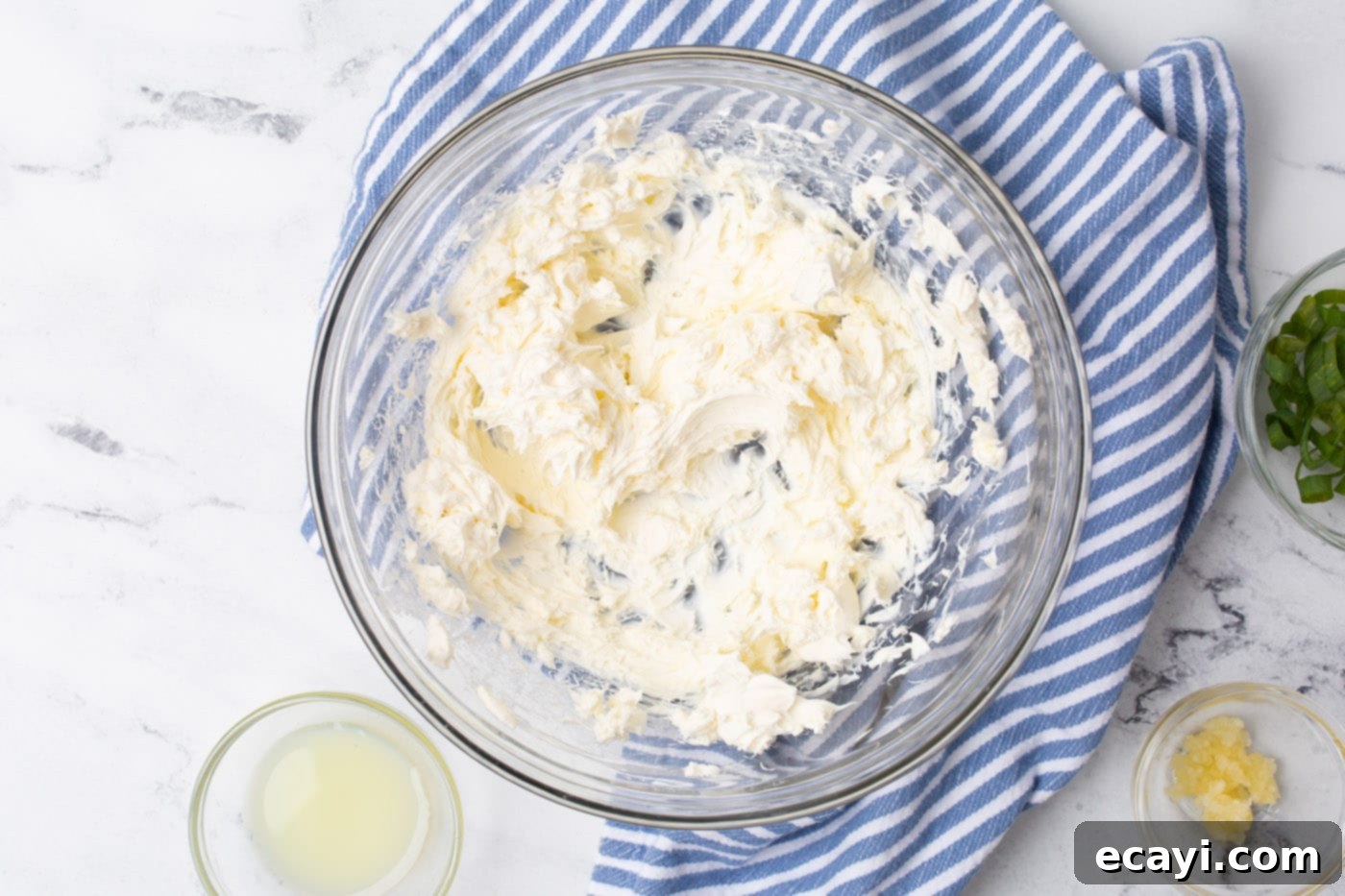 Decadent Crab Dip 5 cream cheese in a mixing bowl being whipped