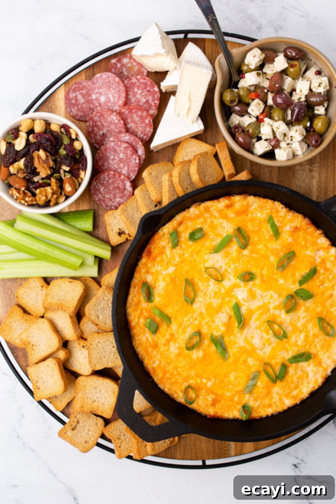 Decadent Crab Dip 8 Crab Dip served on a rustic board with an assortment of crackers and cheese