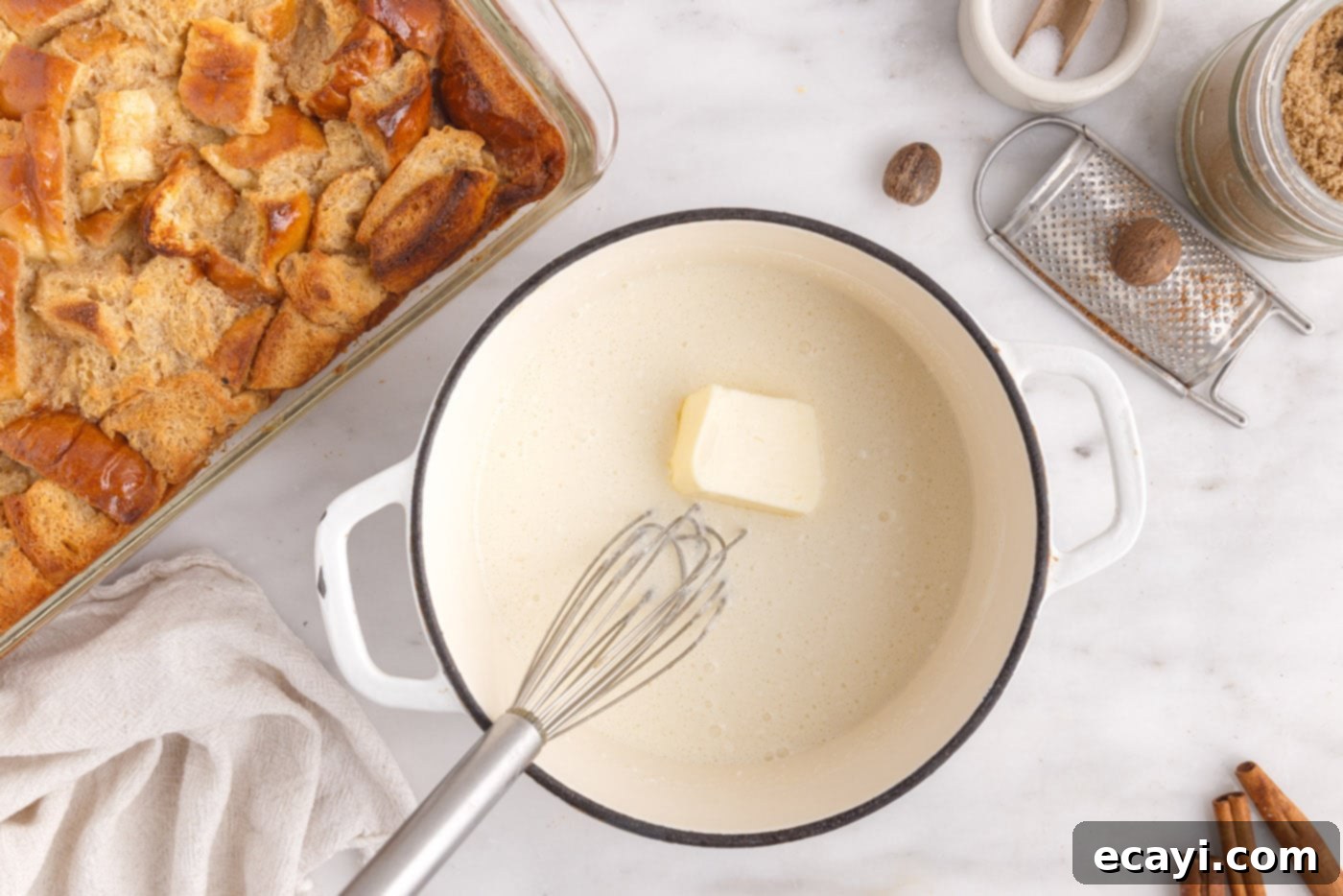 Homemade Bread Pudding Perfection 12 whisking in butter into vanilla sauce