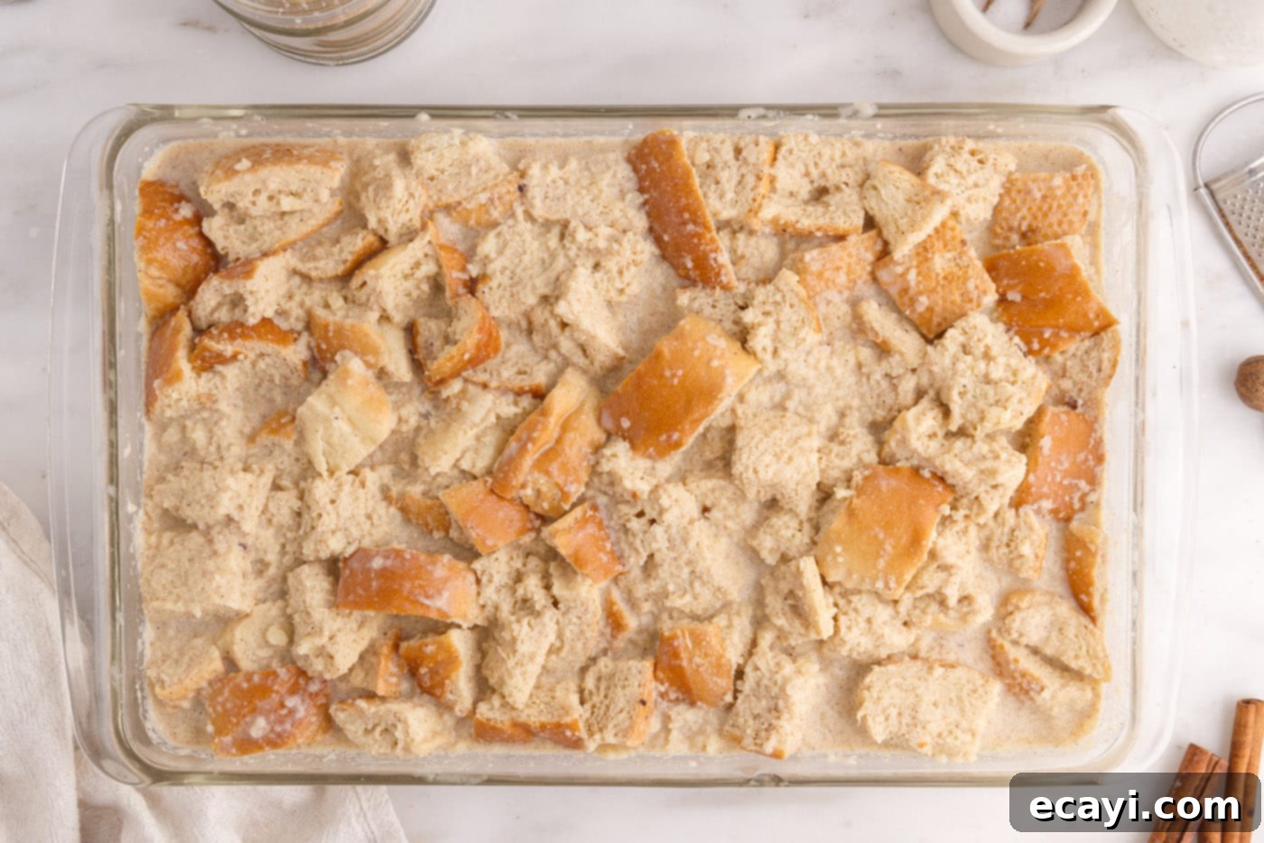 Homemade Bread Pudding Perfection 9 bread pudding soaking in a baking dish
