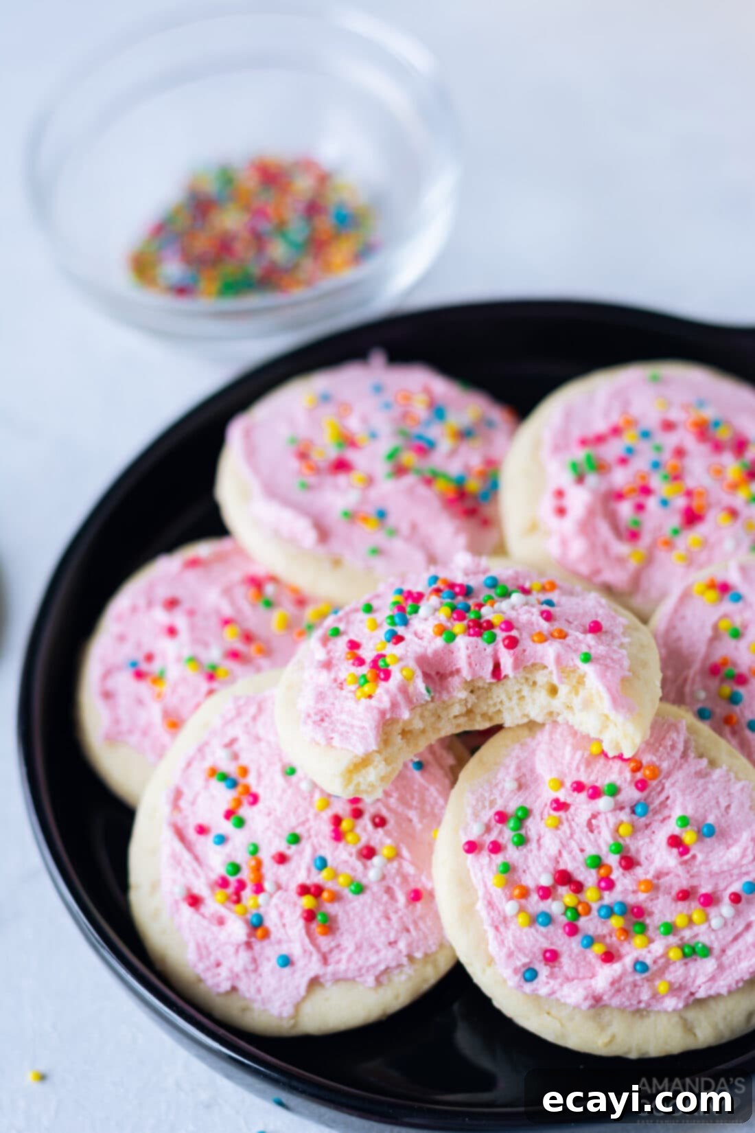 Soft Frosted Lofthouse Cookies 2 Plate of homemade Lofthouse cookies with pink frosting and sprinkles